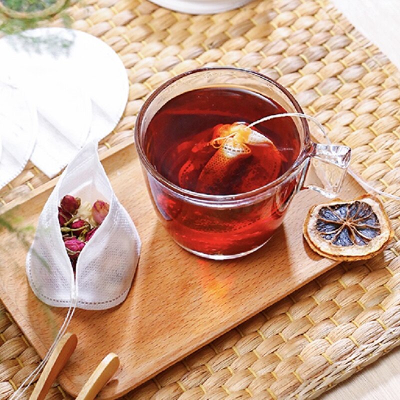 Bolsa de té desechable de tela no tejida, 100 unidades por lote, bolsas de filtro de almacenamiento con cordón para flores secas y hierbas