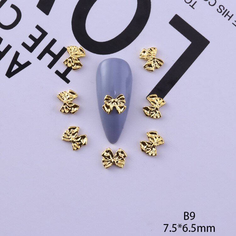 50 pezzi di ciondoli in lega d'oro e d'argento per unghie papillon farfalla 3D multi-forme accessori per unghie per ciondoli gioielli per chiodo arte giapponesi: giallo