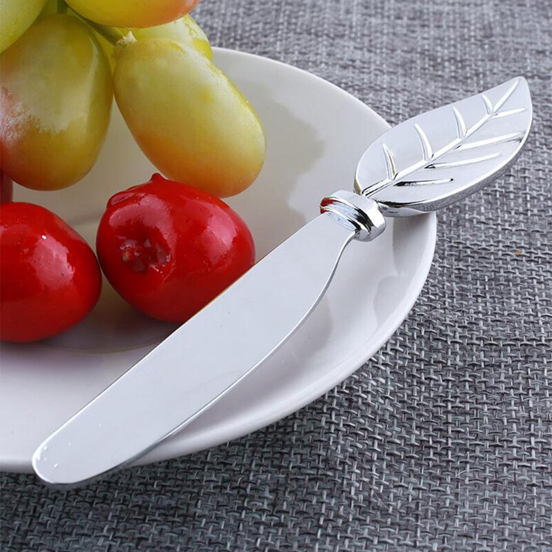 Bordhåndtak blad ost brød smør kniv synke legering herre smør dessert syltetøy ost skjærer smøre tallerken frokost verktøy