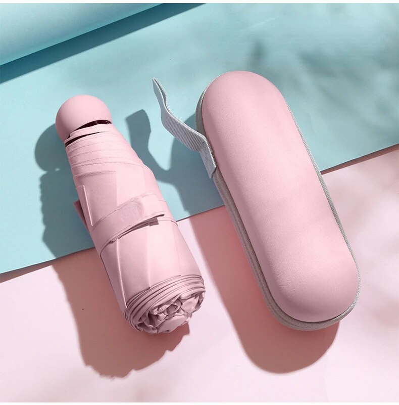 Kapsel Regenschirm klein und tragbar einfarbig Sonnenschirm für Frauen und Regen Dual-Use-Schutz: Rosa