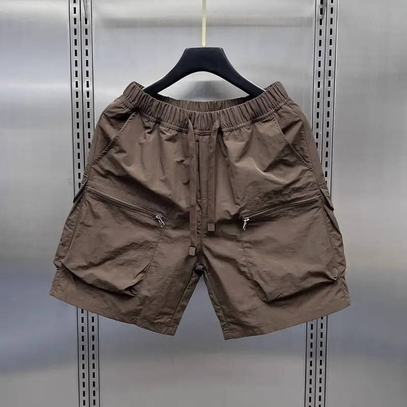 Højtaljede cargoshorts til kvinder sommer tynde, løse, hurtigttørrende shorts med brede ben, koreanske, solide sportsshorts med snøre: M / Sort