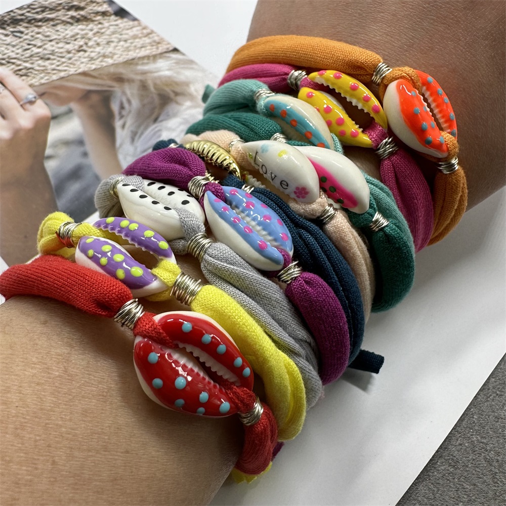 Bracciale con ciondoli a conchiglia a pois Linea di cotone colorata Braccialetti con corde intrecciate fatte a mano per gioielli da donna, uomo e bambino