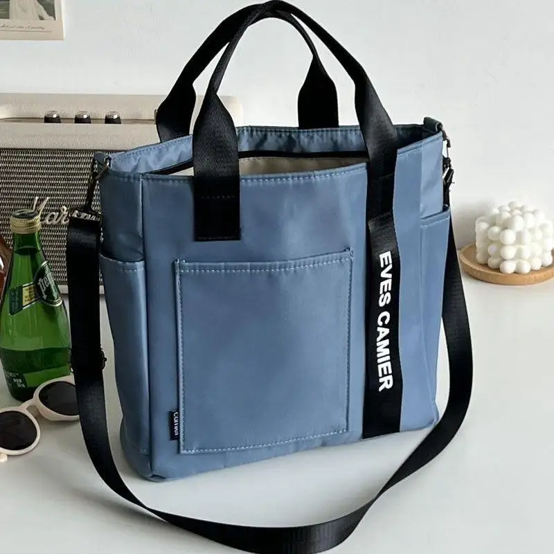 Casual tote tas met grote capaciteit, schoudertas van waterdicht nylon canvas, eenvoudige messenger tas voor schoolmeisjes: Blauw
