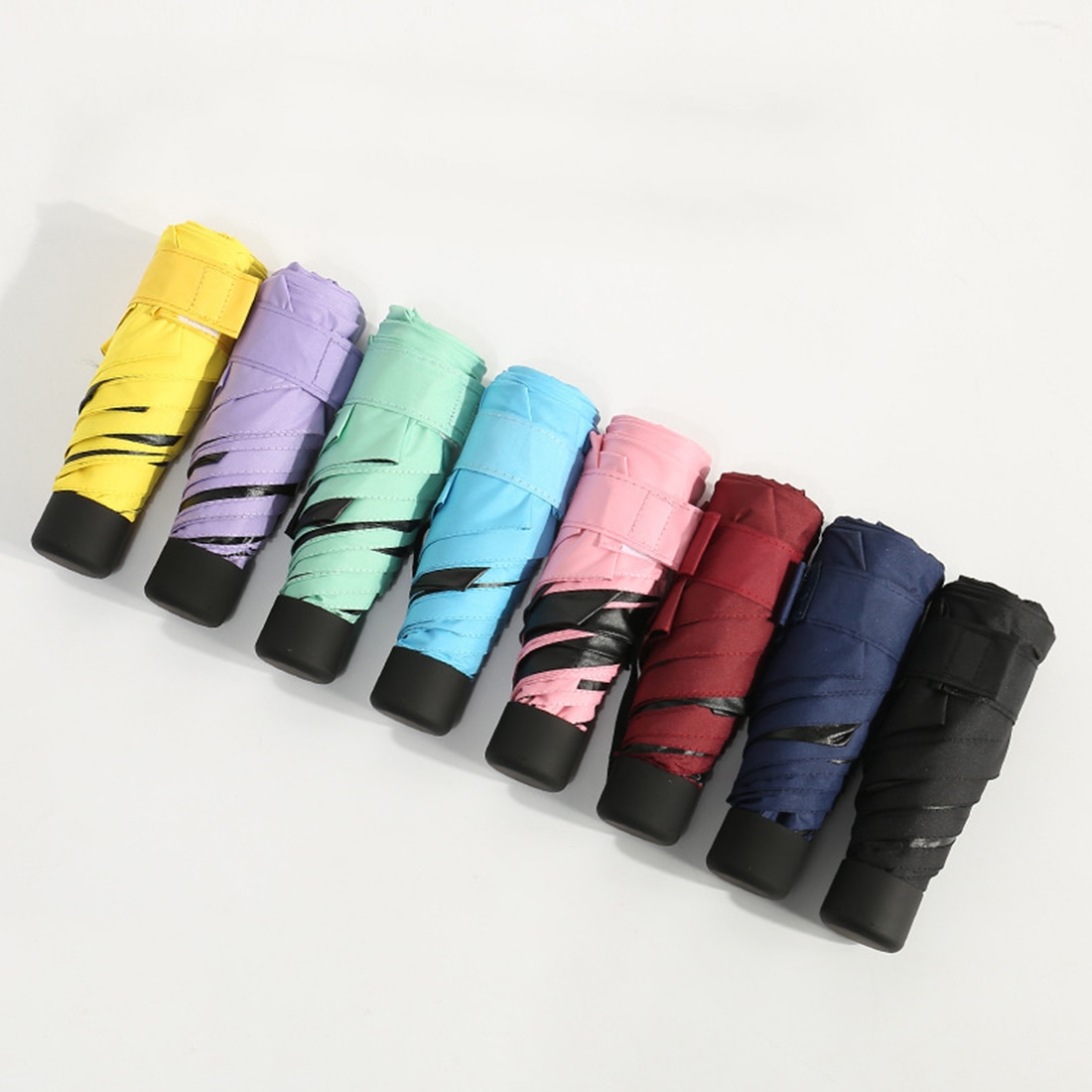 Mini taitettavat sateenvarjot kapseli sateenvarjo mini kevyt pieni tasku sateenvarjot anti-uv taitettavat kompaktit kotelot aurinkoinen sateinen