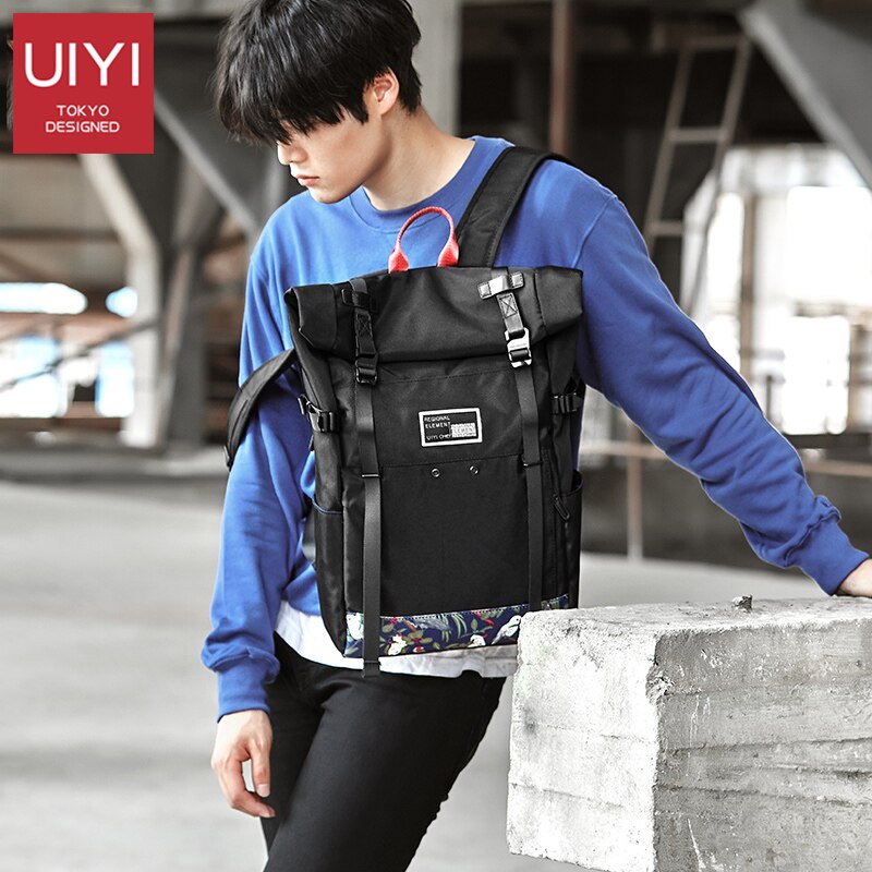 UIYI marca Coreana tampa do rolo de 15 polegada de viagem saco de escola mochila de esportes casuais saco dos homens laptop mochila mochilas à prova d' água