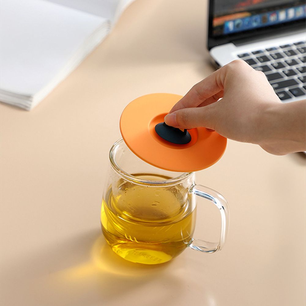 Durable, non-toxic, reusable coffee mug with sealed cover and anti-scalding suction cup lid.