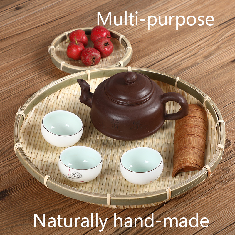 Handgjorda bambu väva korg runda frukt tallrikar platt tallrik på bordet för mellanmål mat bröd picknick grönsaksrätter rotting
