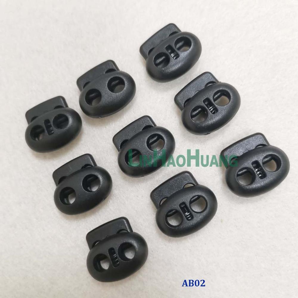 100 stk/lot svart pom plast kule ledning lås veksler plast 2 hull fjær stoppere 4mm strikk sjokk ledning