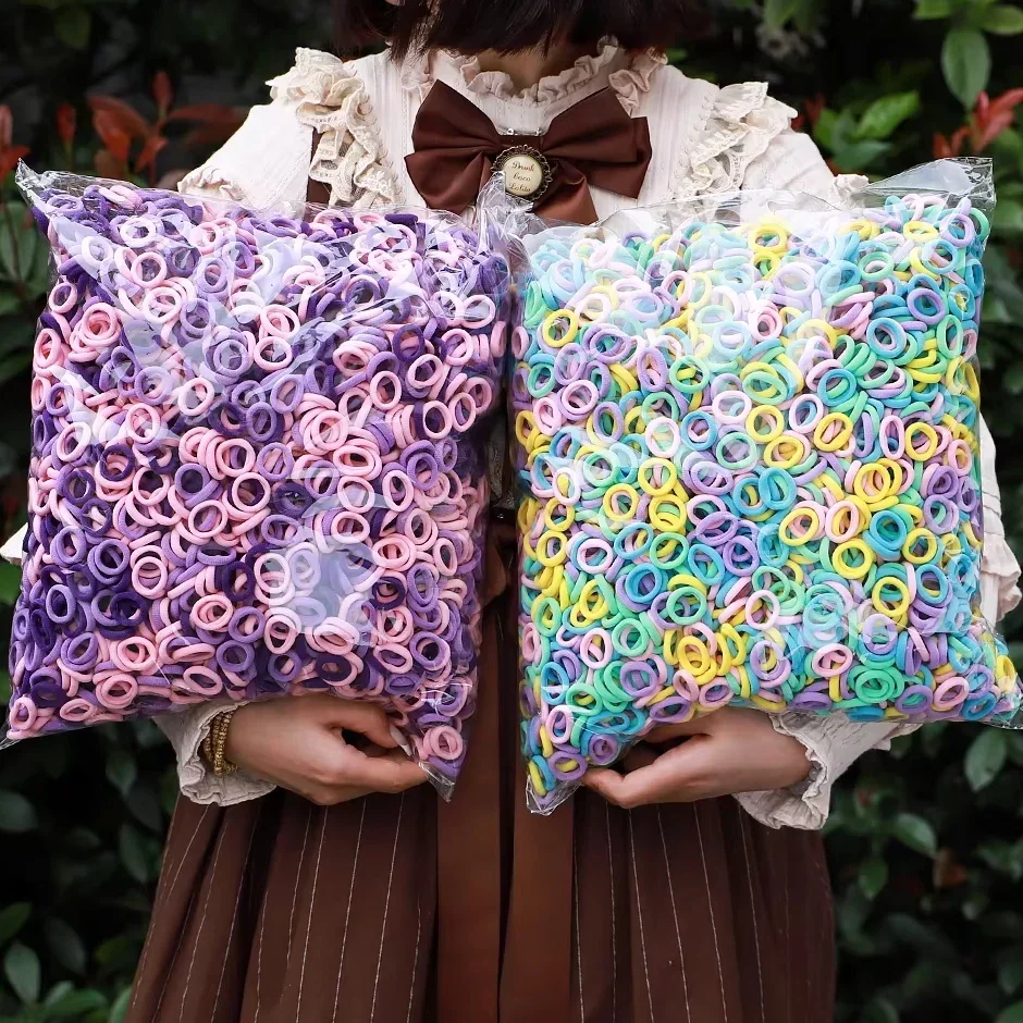 50/100/300 Uds Mini bandas elásticas coloridas para el cabello para niñas accesorios para el cabello diadema de nailon soporte para cola de caballo para niños adorno Scrunchie