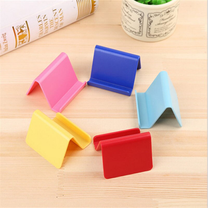 Soporte para teléfono móvil Candy Mini, soporte fijo portátil, suministros para el hogar, plástico, Color aleatorio, 6*4,5 cm