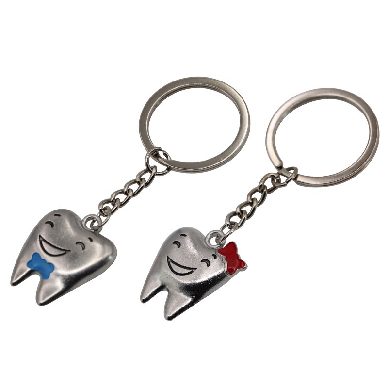 Llaveros con forma de modelo de dientes de dibujos animados, llaveros de acero inoxidable, de clínica Dental, decoración de dentista, 2 uds.