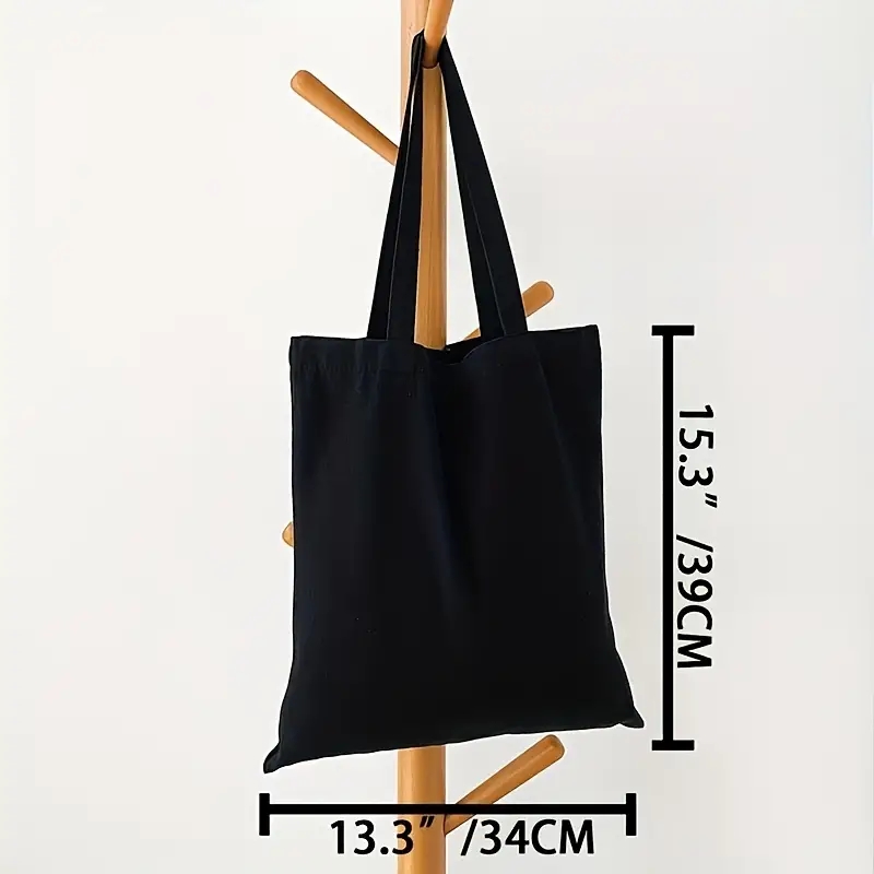 Einfache und lässige einfarbige Segeltuch-Material-Handheld-Umhängetasche für Damen mit großer Kapazität zum Einkaufen und Reisen: Schwarz