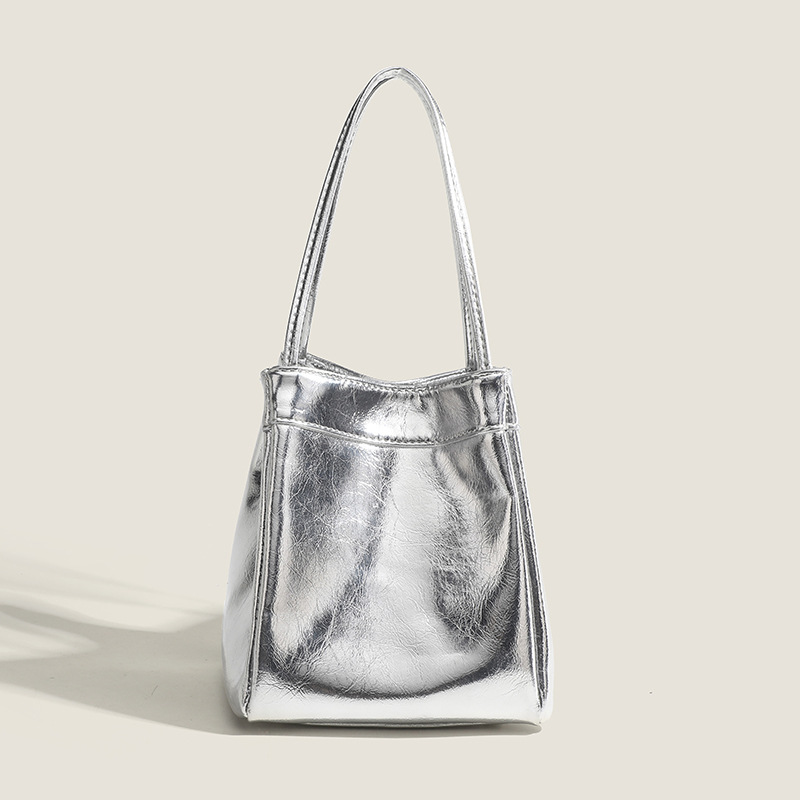 Zilveren bucket bag voor dames 2024 modieuze en eenvoudige lunchbox tas, niche westerse stijl textuur draagbare kleine tas