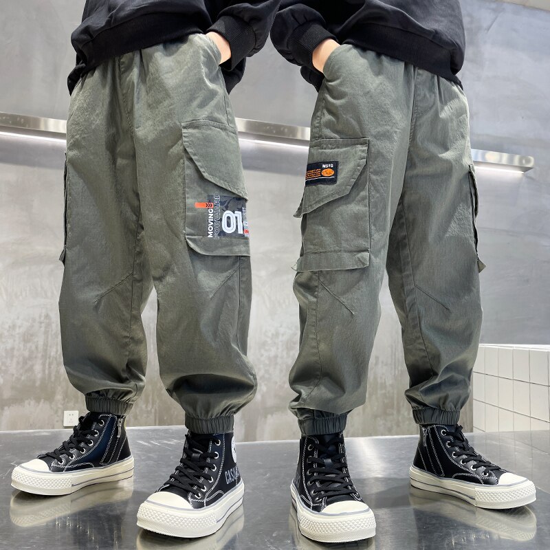 New Fashion Joggers pantaloni Cargo ragazzi pantaloni Harem stampa multi-tasca pantaloni sportivi per bambini grandi pantaloni Hip-Hop Streetwear pantaloni Casual