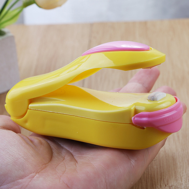 Bärbar hushålls mini förseglingsmaskin mat plastpåse resor hand tryck förseglingsmaskin pulsförsegling förseglingspaket: Gul