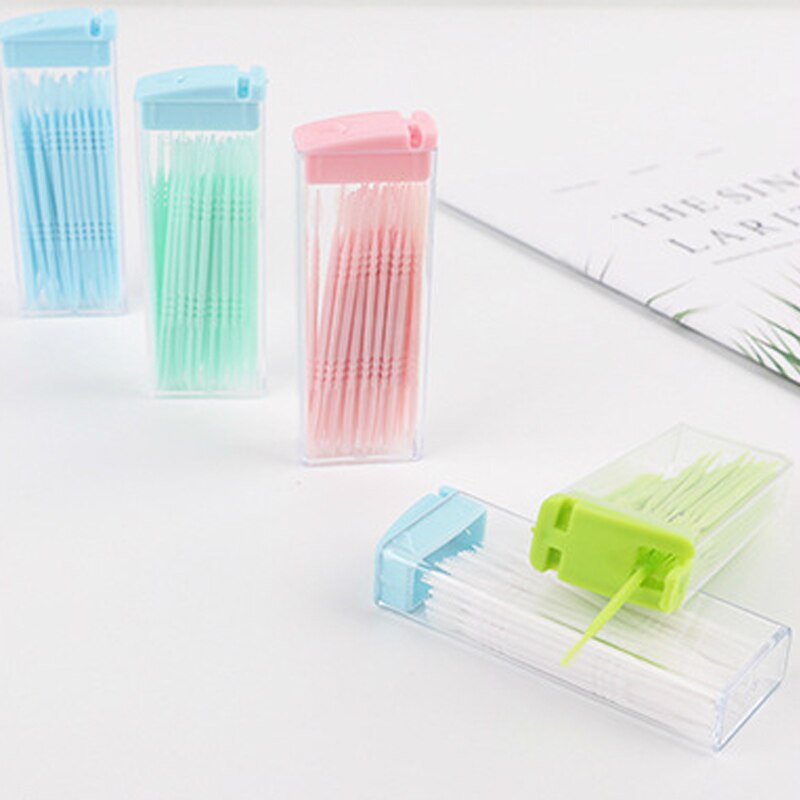 Palillos de dientes de plástico de dos cabezas, palitos de hilo dental desechables de Color aleatorio, herramientas de limpieza respetuosas con el medio ambiente, accesorios de viaje, 50 Uds.