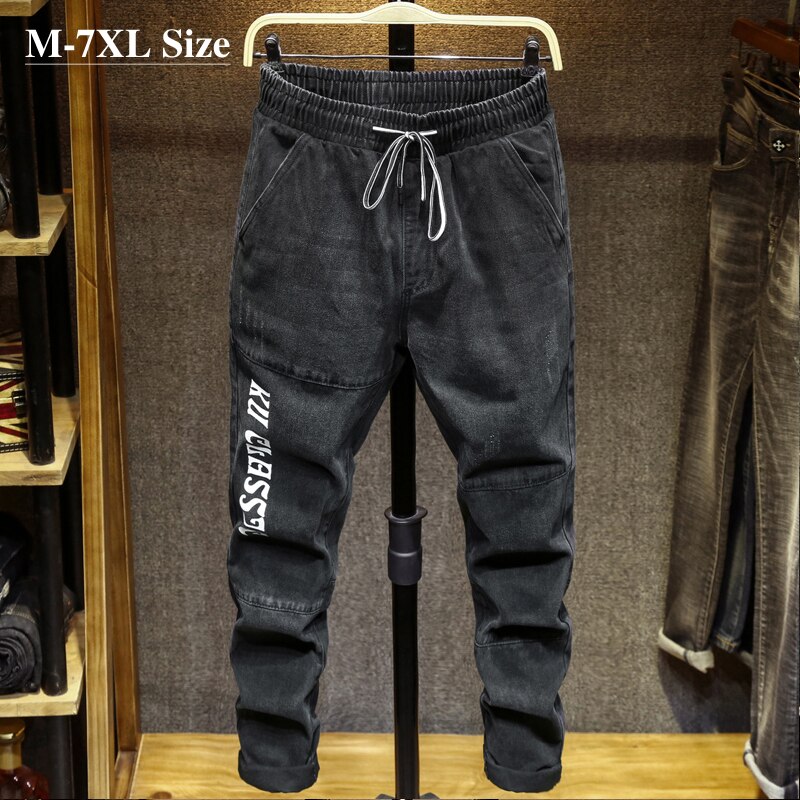 Plus størrelse 5xl 6xl 7xl efterår mænds afslappet harem jeans brevprint sortgrå elastik denimbukser mærkebukser mand