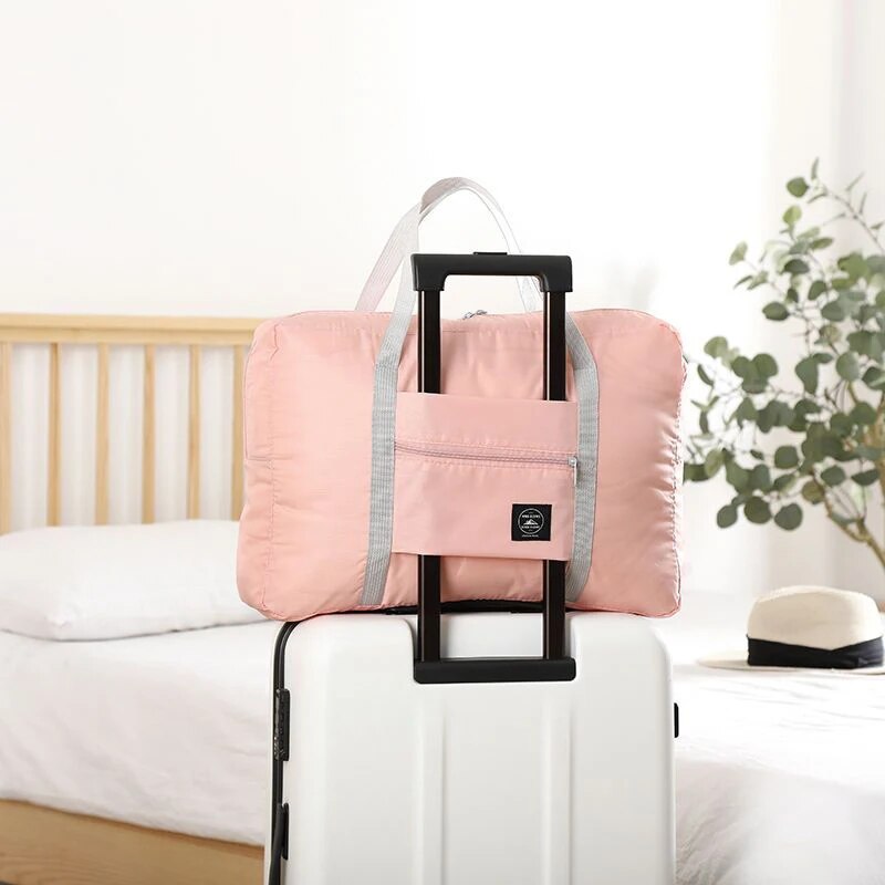 Modieuze opvouwbare reistas: spatwaterdichte handbagage met grote capaciteit voor unisex fitness- en vakantiereizen: Roze