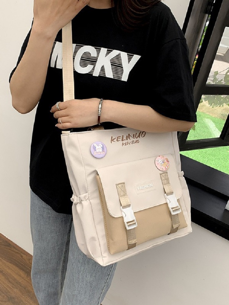 Søt jenteskulderveske skoleveske kvinnelig ins universitetsstudent lerretsveske crossbody stor kapasitet bokveske messengerveske