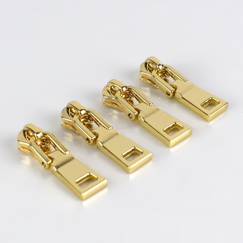 10 kpl jousilukkoa 3#  vetoketjun liukusäädintä metallisille vetoketjullisille takeille vaatteiden vetoketjun korjaussarja vetoketjun vetimet tee-se-itse-laukkujen ompelutarvikkeet: Vaaleakulta -no3