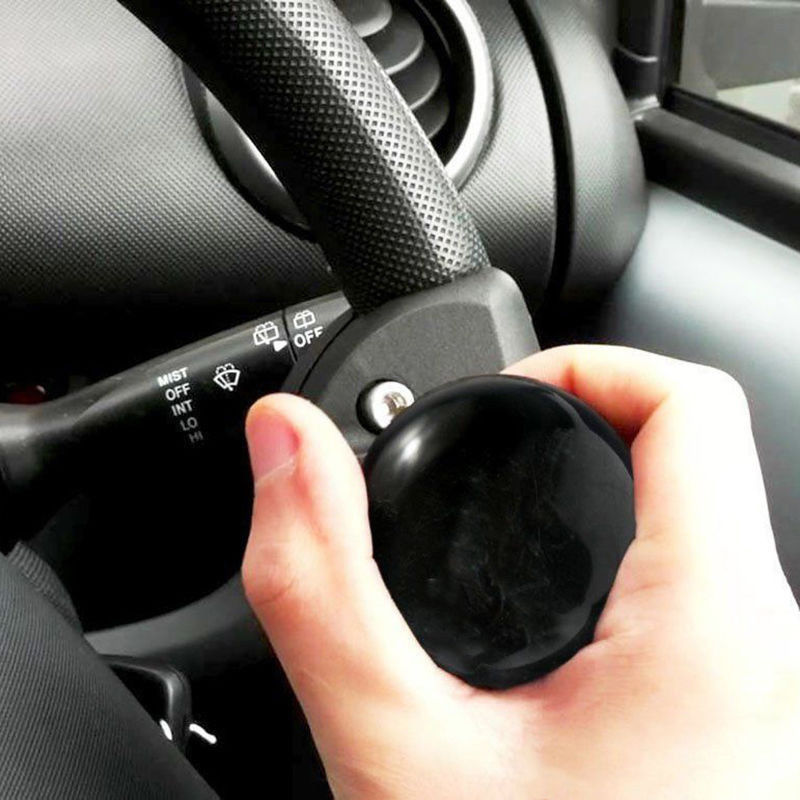 Svart bilratthjälp krafthandtag hjälpa spinnerknoppkula