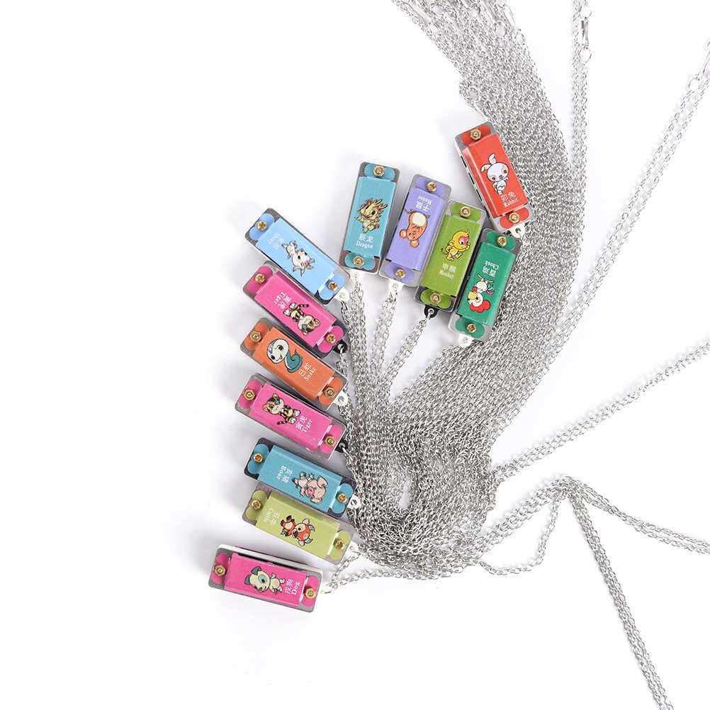 1pc plastica + metallo Mini durevole metallo armonica 4 fori 4 tono collana colore casuale