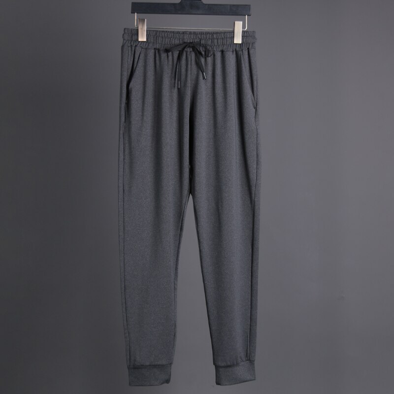 Pantalons longs en cours d'exécution hommes Polyester mince Sport entraînement Joggers poches solides pantalons de survêtement Compression hommes pantalons décontractés: grey / XS