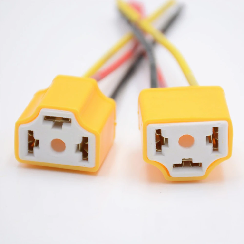 Adaptador de enchufe de Base de bombilla H4 para coche, portalámparas de cerámica Universal H4, arnés de cableado, Base de bombilla de faro, enchufe de haz de luz, 2 uds.: YELLOW