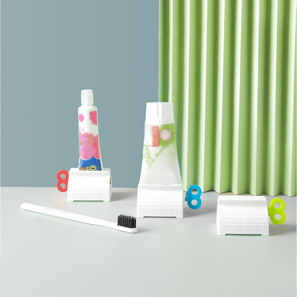 Multifunctional Plastic Bathroom Tube Squeezing Dispenser Rolling Tube Stand Holder Squeezer Toothpaste Squeezer Dispenser