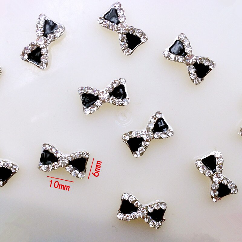 10 stks/zak Japan 3D Nail Art Deco Metal Nail Accessoire Zwarte Boog Knoop met Glitter Clear Crystal DIY Charm nail Gereedschap