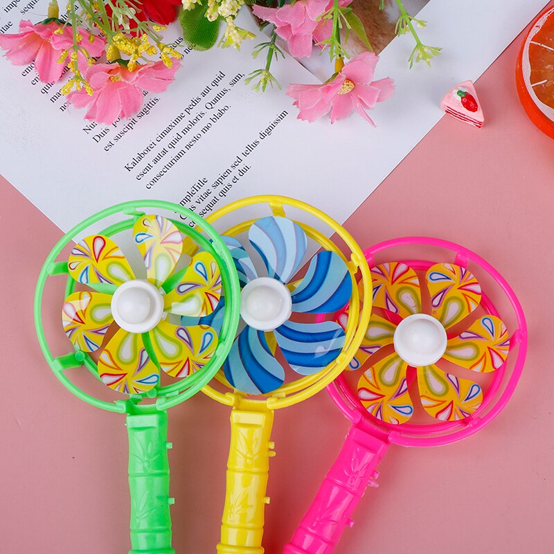 Molino de viento de plástico para bebés y niños, juguete infantil de molino de viento pequeño colorido, con mango silbante