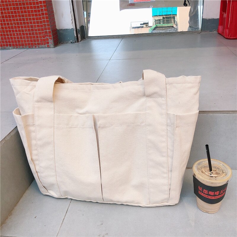 Ins lazy wind multi-pocket canvas bag large capacity commuter single shoulder tote bag female student large tote: Beige