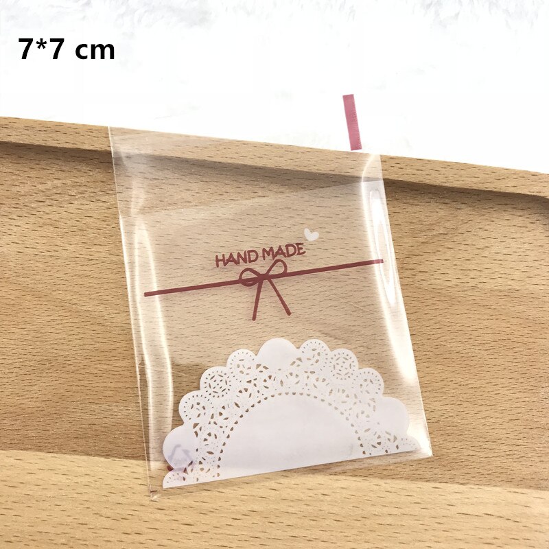 2 maten 100 stks Plastic Cookie Tassen Transparant Kant boog-knoop Cookie Bag Bruidstaart Snoep Macaron Verpakking Zak: 7X7cm