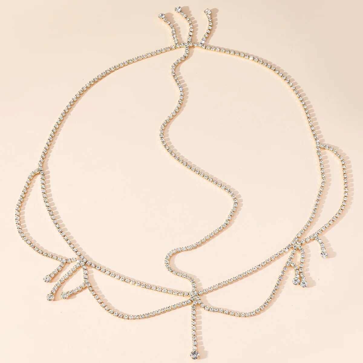 Haaraccessoire met meerdere lagen strass-steentjes en franjes.: Goud