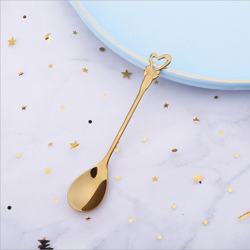 Japanese-style stainless steel coffee spoon dessert series set home kitchen rose four-leaf clover cartoon spoon: Golden hollow heart