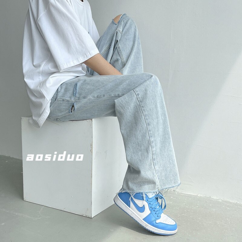 Letnie jeansy szerokie nogawki męskie modne oświetlenie niebieskie dorywczo porwane jeansy męskie Streetwear luźne spodnie biodro-hopowe proste spodnie jeansowe męskie