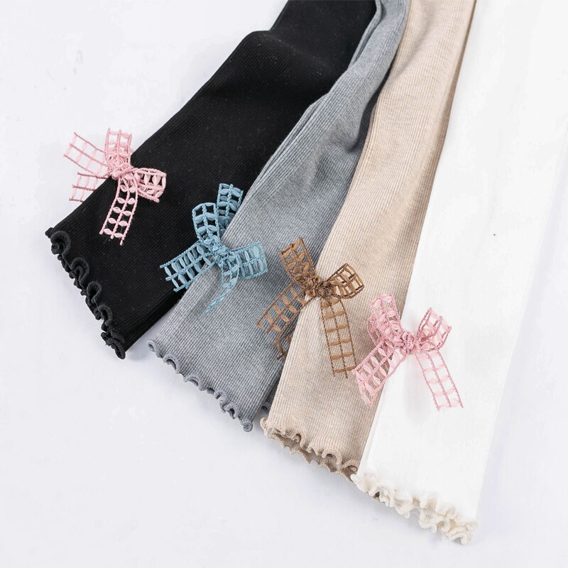 Cute girl hollow bow knot orecchie di legno pantaloni a nove punte primavera e autunno leggings slim per bambini a sezione sottile verticale sottile