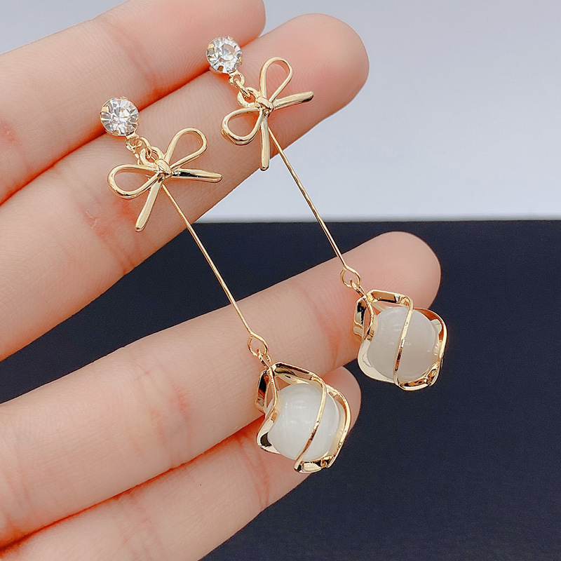 Trendy oorbellen met metalen frame en hangende opalen voor dames, gouden strass-steentjes, strikjes, lange sieraden voor bruiloften en feestjes.