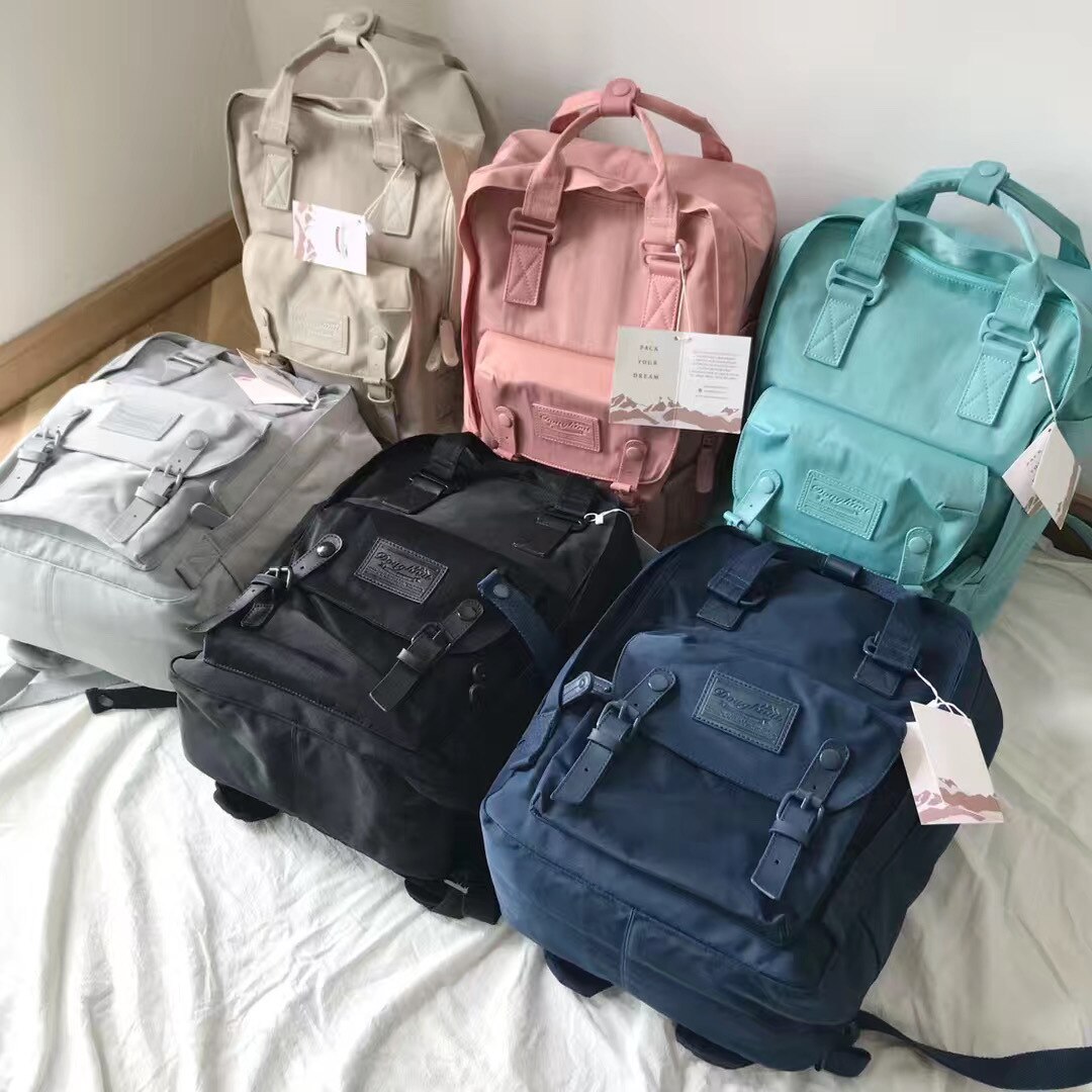 Mochila de viaje de viento de Hong Kong ins para hombres y mujeres, nueva mochila escolar de ocio de para actividades al aire libre