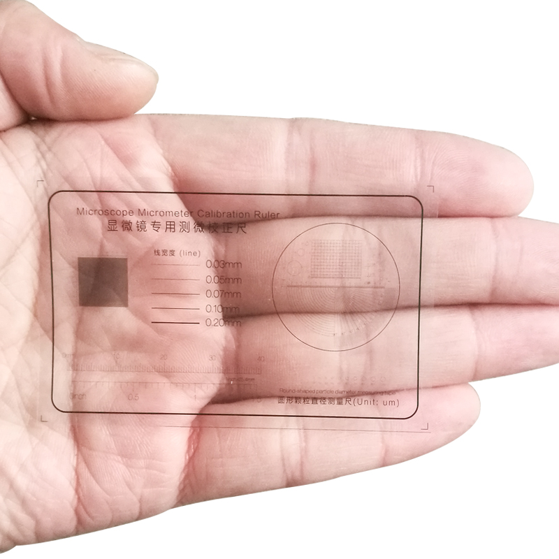 Kalibracja linijka folia przezroczysta mikrometr mikroskopu zwierzę domowe okrągły kształt średnica cząstek taśma pomiarowa linia współrzędnych