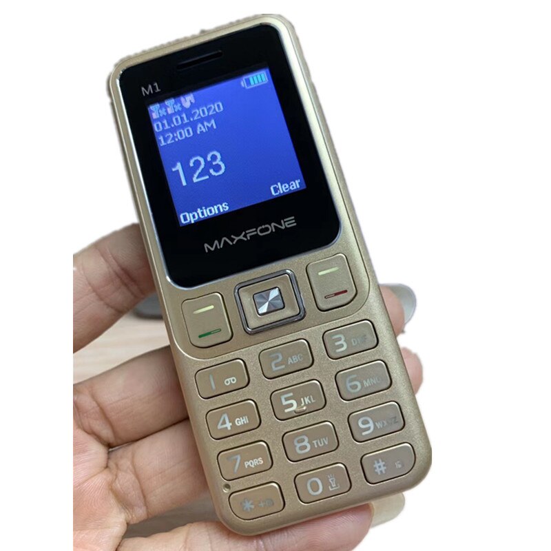 Mini-mobiel met m1 drukknoppen, 1.4 inch dual-sim, basistoetsenbord, zaklamp,  mp3 camera's, fm-radio, kleine goedkope mobiele telefoon