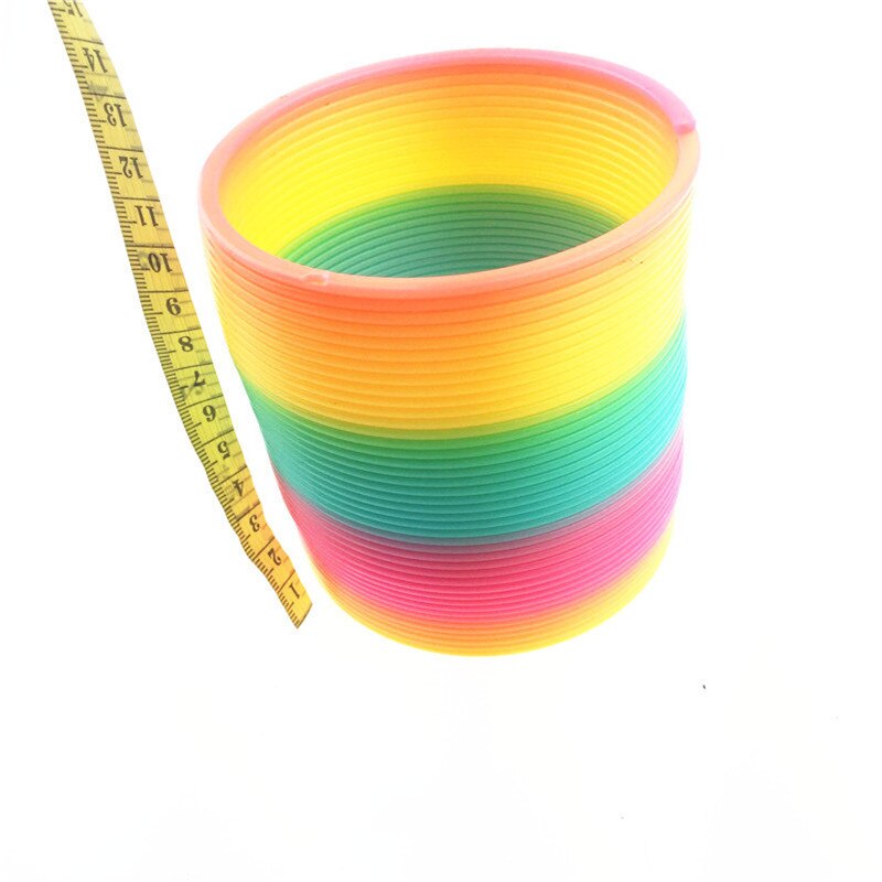 Stor størrelse 10cm børn magisk plast regnbue forår farverige børn cirkel spole elastisk ring til julefødselsdag