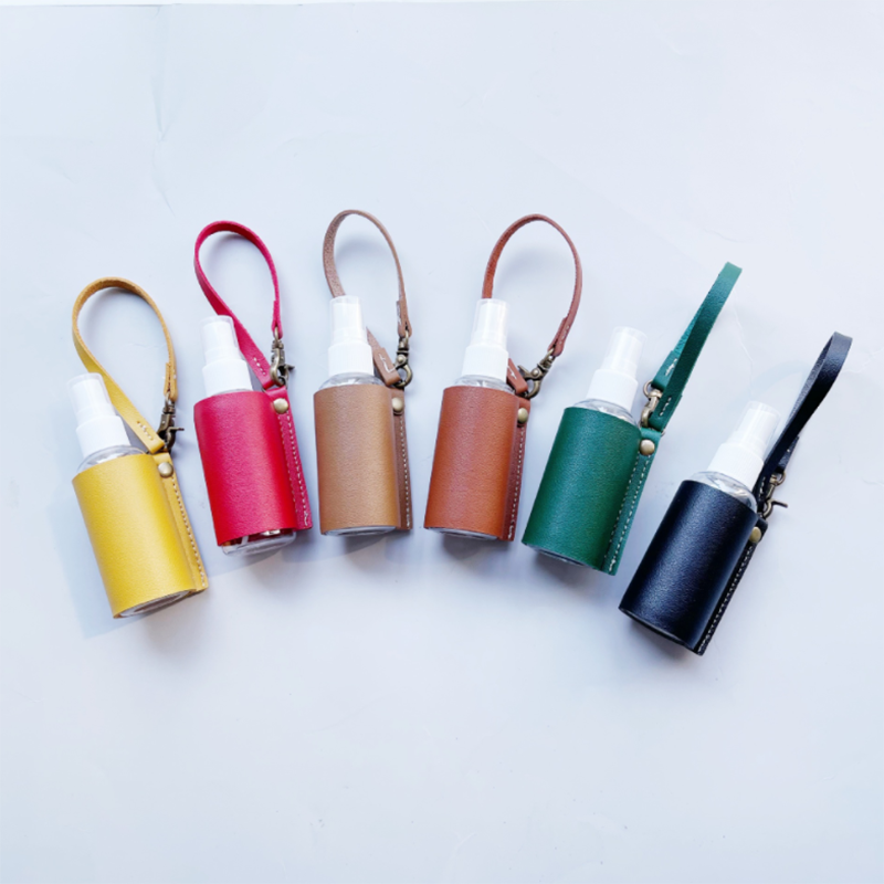LLavero de Gel hidroalcohólico, funda desinfectante de manos, minibotella de Gel hidroalcohólico portátil, Funda de cuero, llavero de salud, 1 ud.