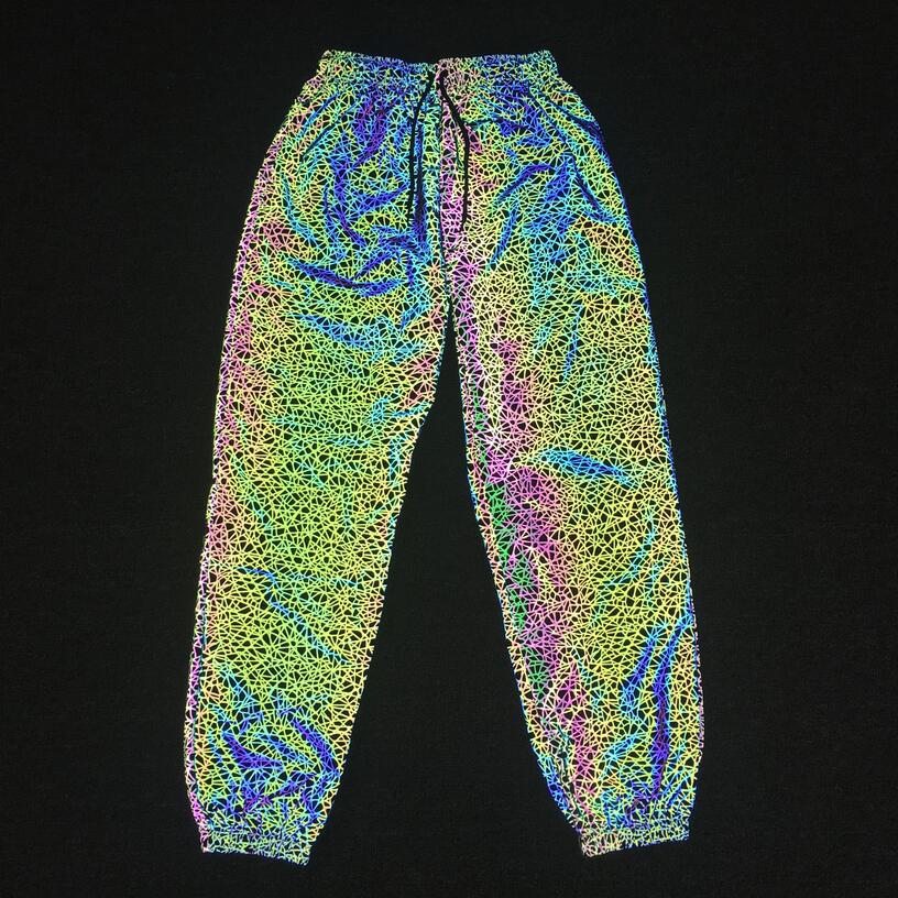 Pantalones Jogger informales luminosos coloridos de hip-hop para hombres europeos y americanos con patrón caótico reflectante