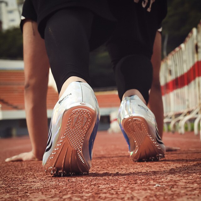 Las mujeres los hombres cómodos de pista y campo de Spike uñas corriendo zapatillas de velocidad ligera antideslizante zapatos D0868