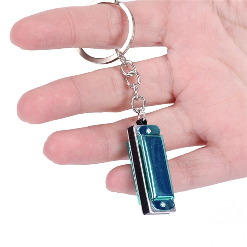 1 pc mundharmonika legetøj nøglering mundorgel nøglering vedhængende rad sølvfarve tilfældig 4.2*1.4*1.1 cm