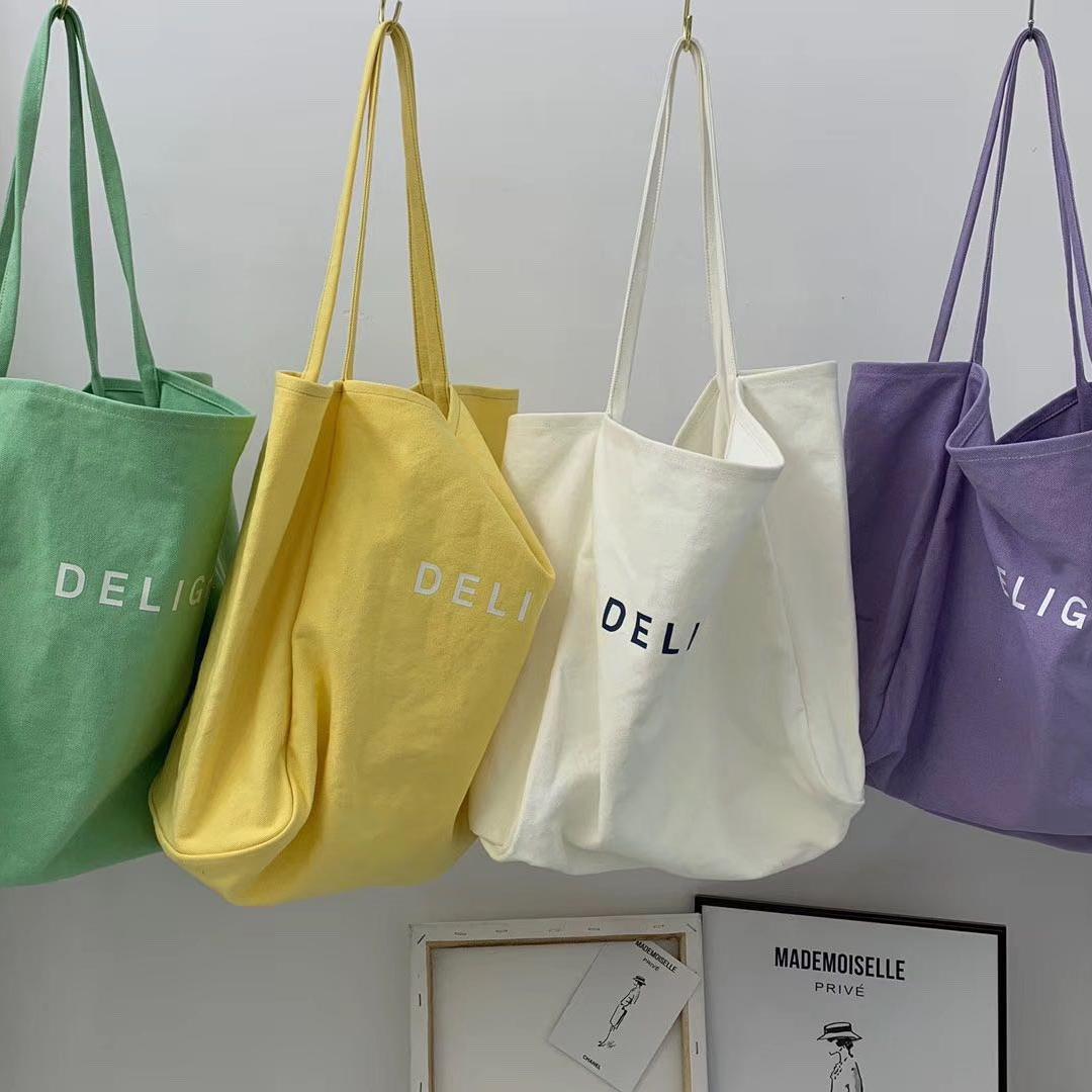 Einfache damen-schultertasche aus canvas, großes fassungsvermögen, umweltfreundliche einkaufstasche in bonbonfarben, lässige tragetasche für damen.