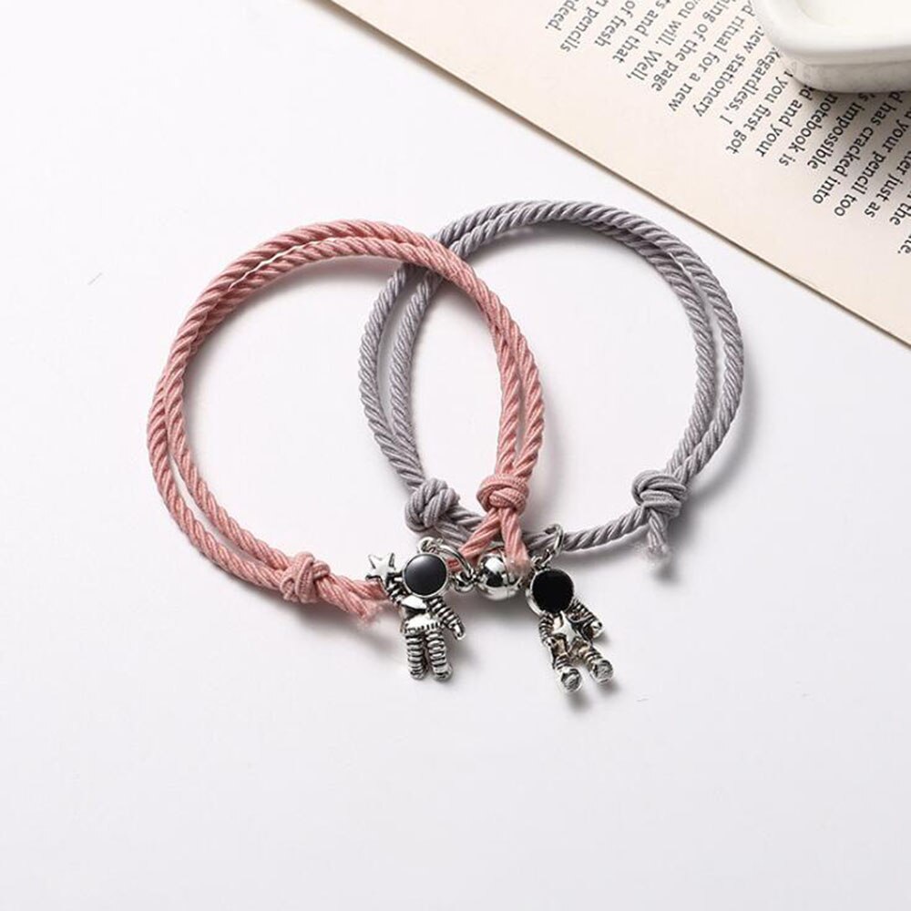 Pulsera de pareja astronauta pequeña banda de Goma para enviar novia novio imán piedra brazalete con cascabel nudo de la cuerda de la joyería: Pink Gray