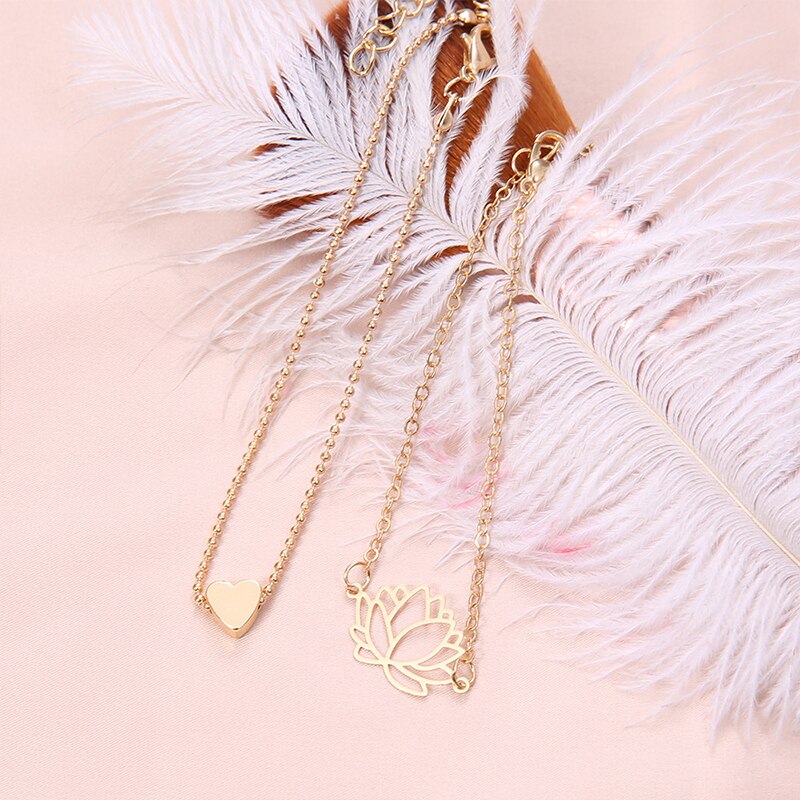 2 unids/set Simple ahueca hacia fuera Lotus pulseras encantadoras mujeres de oro en forma de corazón pulsera de cadena romántico de joyas de
