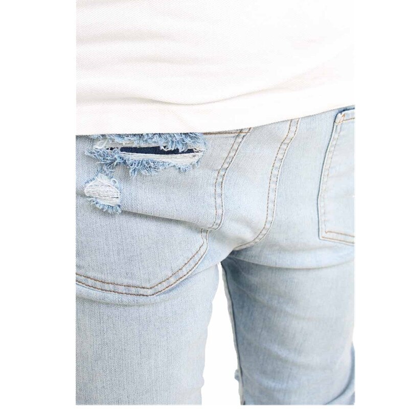 Märke man knä stort hål jeans vårtvätt ljusblå jeansbyxor herr nödställda slitna skinny jeans herr